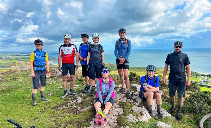 Riders at the end of an epic 6 day crossing of Wales. Gower, South Wales.